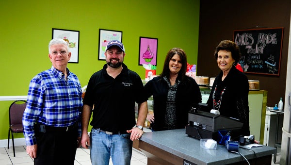 Sue Cleckler (right) opened Cakes n' Candy with about five employees making cakes for retail sales. Her husband, Junior, and daughter, Stacey have since joined in helping make the business a success story.