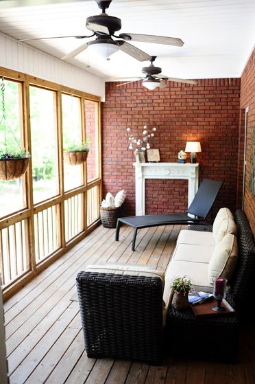 The back porch (above) is one of the family's favorite areas of their house. Overlooking the backyard, the porch is a comfortable gathering place for the family.
